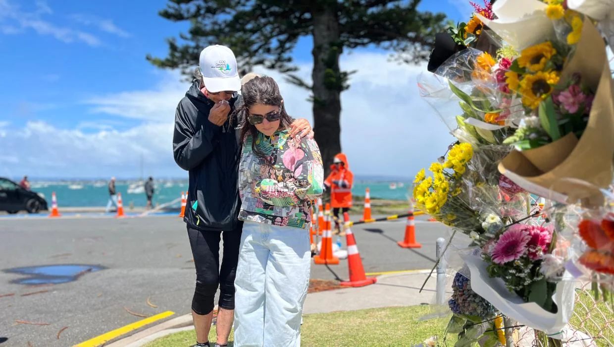 Carol Wilson, left, and Lani Doidge met for the first time at the makeshift shrine near the Mount. Photo: Tony Wall / Tony Wall
